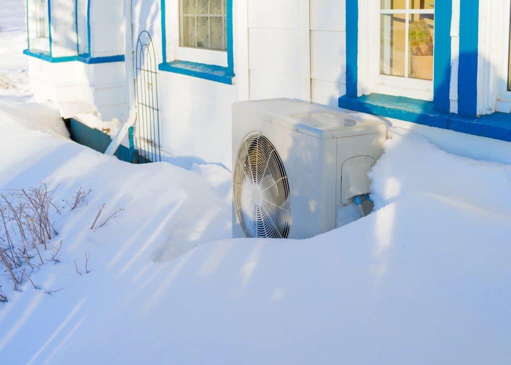 Residential heat pump in a snow bank.