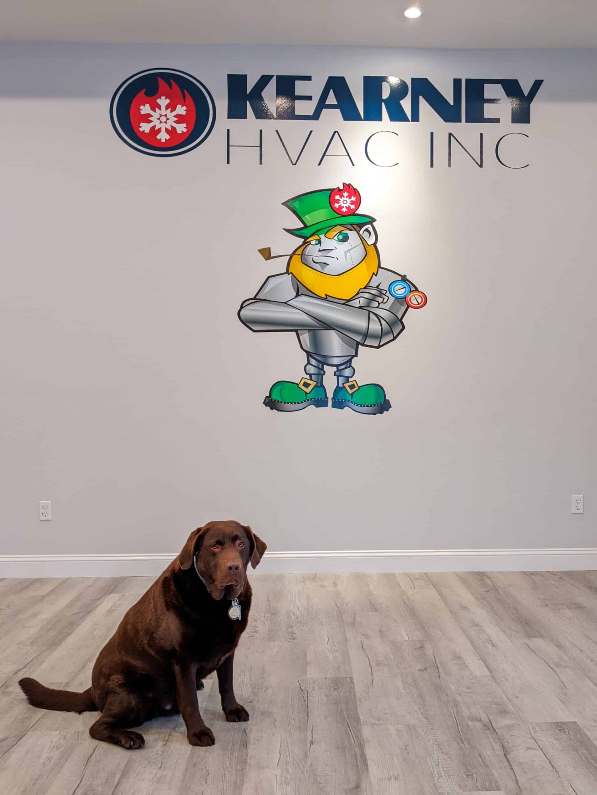 Leroy in front of Kearney logo in showroom