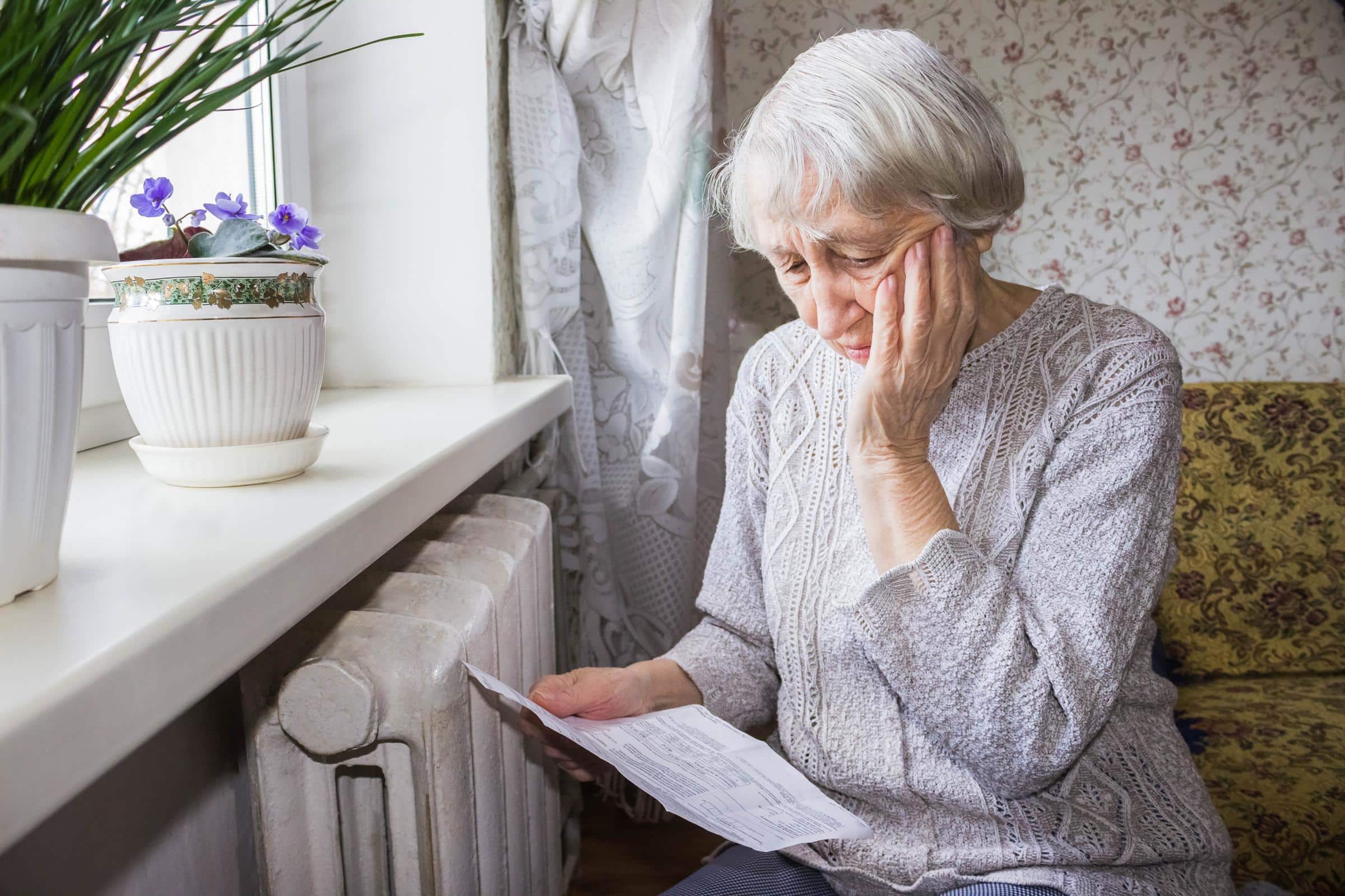 Woman distressed reading bills