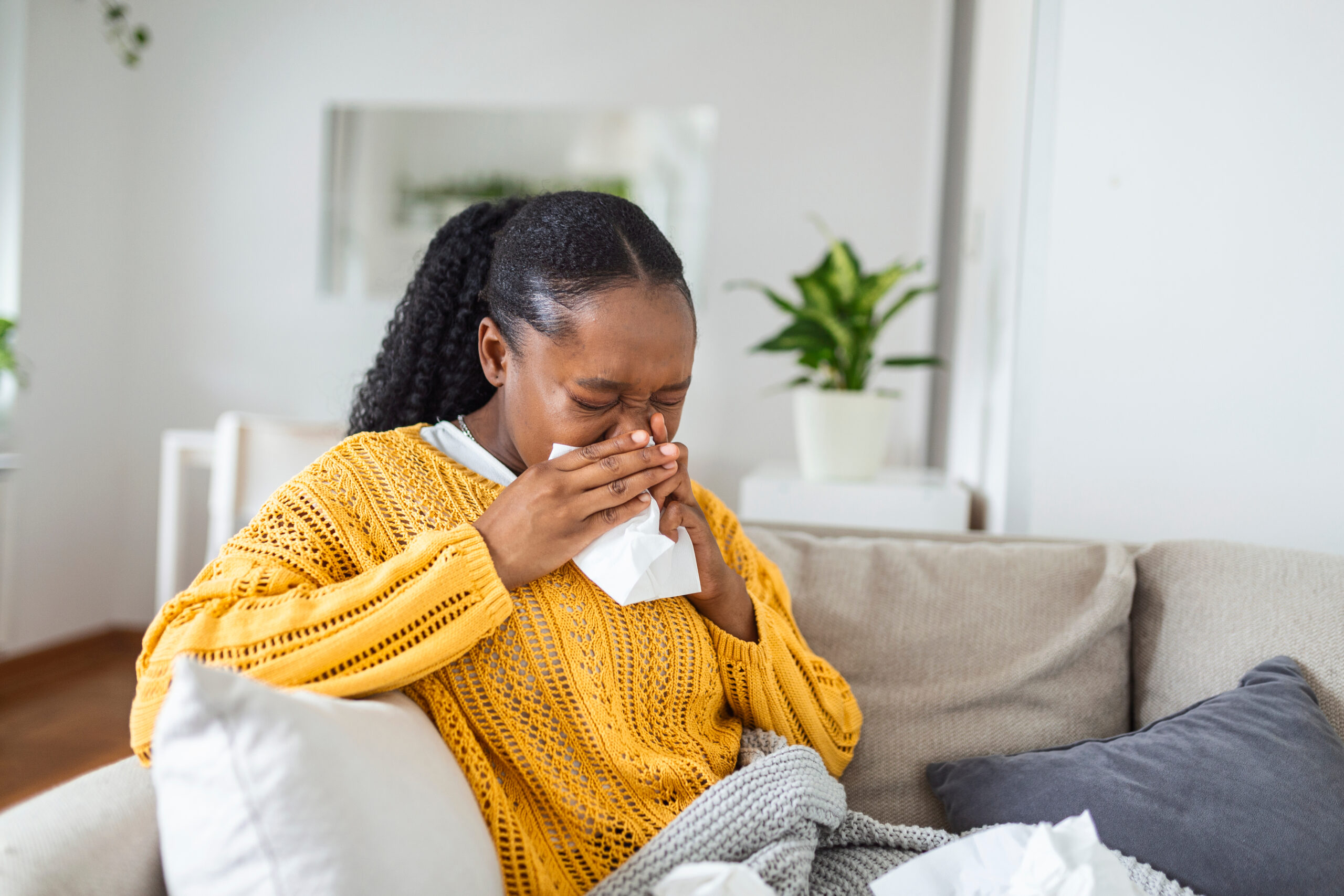 woman blowing her nose