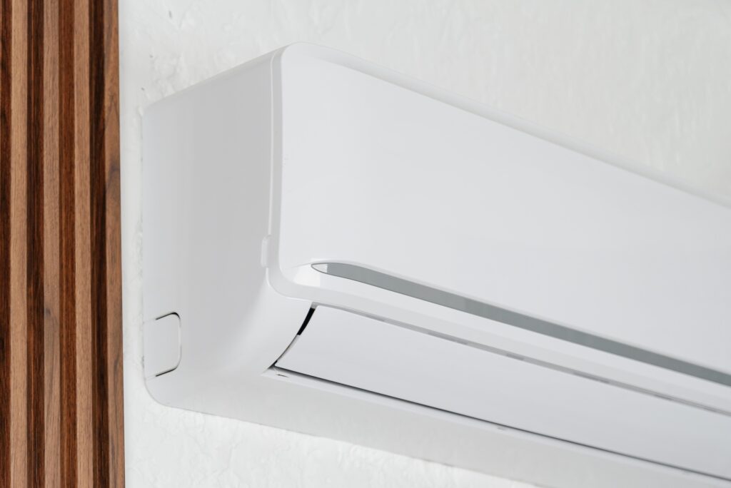 heat pump on a wall blowing warm air